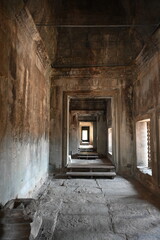 Obraz premium The sunlight of the sunset is illuminating nicely the stone carvings on the Bayon Temple in Angkor Thom near Siem Reap, Cambodia