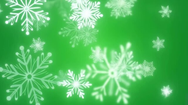 White snowflakes gently falling on a vibrant green background. Perfect for holiday-themed projects and winter celebrations