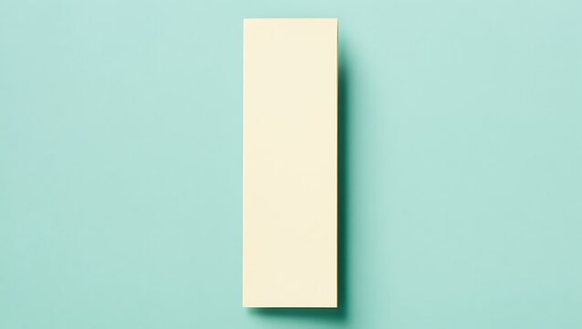 Mockup of a bookmark with a blank page on a flat surface