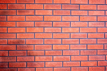 Obraz premium Red brick wall background with clean horizontal pattern and textured masonry surface, suitable for construction or design backdrop.