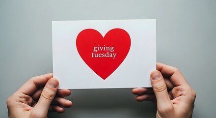 Obraz premium heart in hand, Hands Holding White Giving Tuesday Card with Red Heart for Charity and Donation Concept