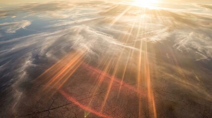 Sky with bright sun and extreme global climate concept. Stunning aerial view of sun rays over a tranquil landscape.