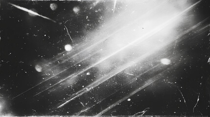 Fototapeta premium retro film overlay effect with scratch dust and bokeh light leaks,retro grain noisy film distressed light leak flare on black background,black and white abstract background,Abstract old film texture