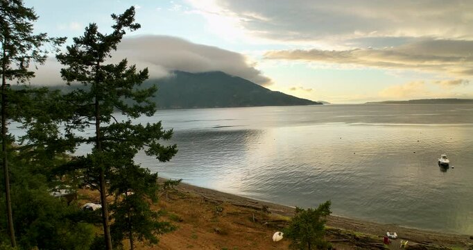 Rotating Aerial Around Coastal Tree Showing Island Life on Eliza Island Near Lummi and San Juan Islands