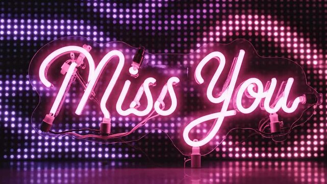 Illuminated "Miss You" text rendered in pink neon set against a dotted background with reflective surface below