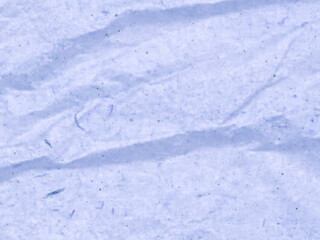 Obraz premium Abstract textured background in shades of light blue. The crumpled surface creates interesting patterns
