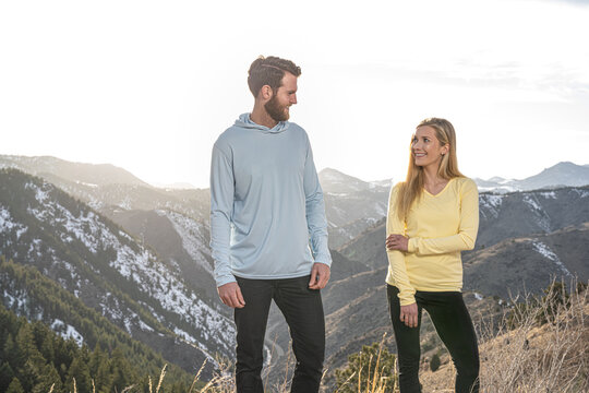 Couple flirting on hike in the mountains
