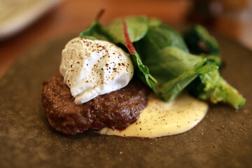 Beef steak with poached egg and hollandaise sauce
