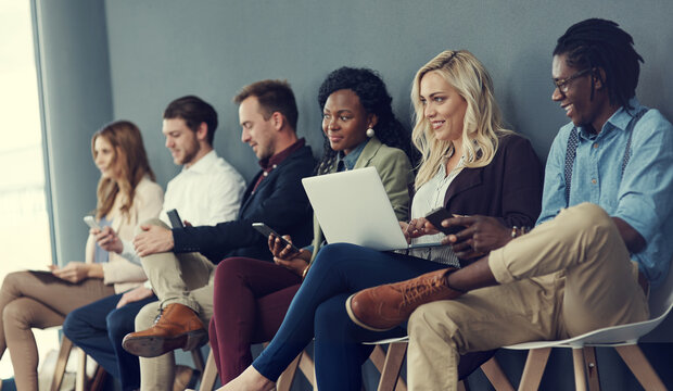 Recruitment, group and people with technology in waiting room, interview preparation and opportunity. Diversity, laptop and applicant queue with phone for online hiring tips, job search and hr office