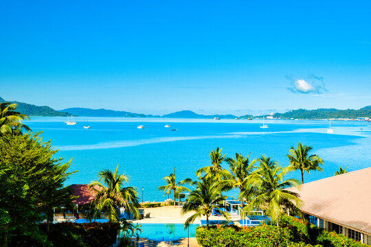 A beautiful view of Langkawi island against a beautiful blue sky with  some boats in the distance on the horizon. Tropical scenery. located at Kedah, Malaysia - September  25  2024:
