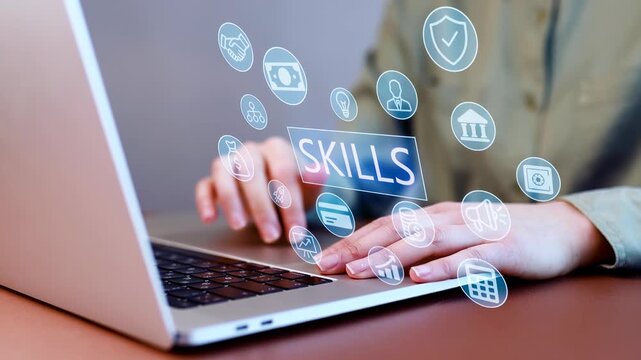 Digital skills and technology concepts are shown while a person types on a laptop in a workspace setting.