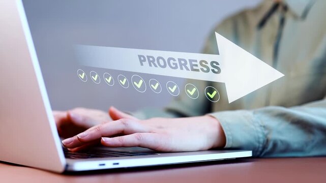 Woman types on laptop while checking off tasks marked with green checkmarks on a screen in an office setting.