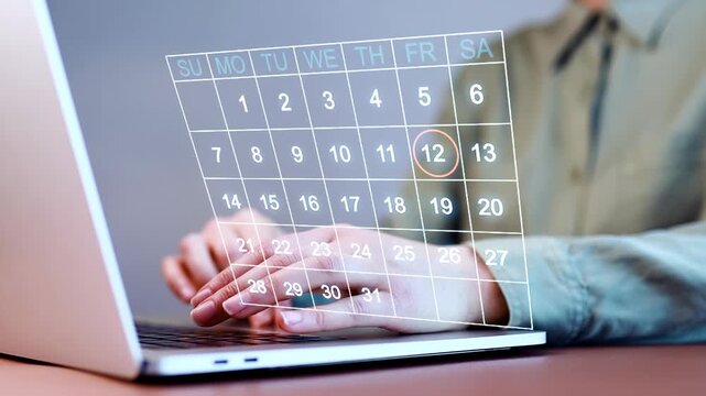 Working on a laptop with a calendar displayed for scheduling tasks and managing time in an office setting in the morning hours.