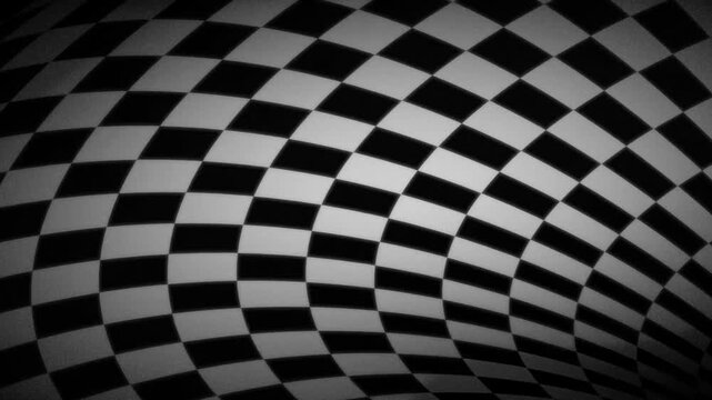 Close view of a warped black and white checkered surface showing curvature and distortion in a visually dynamic abstract pattern