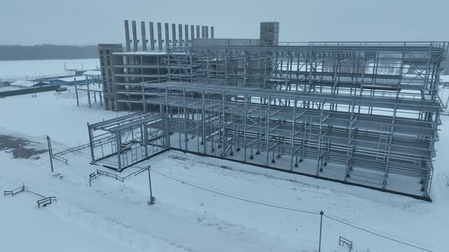Dense network of exposed concrete and metal structures shapes future building volume. Repetitive lines emphasize engineering complexity