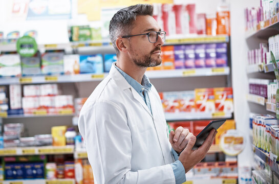 Pharmacist, man or inventory inspection with tablet for online order, prescription or product info. Health professional, mature person or tech with stock take in pharmacy for label accuracy or retail