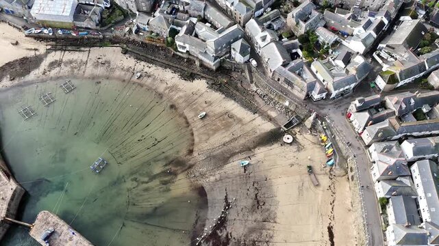 Aerial view Over Mousehole Harbour In Cornwall, UK.