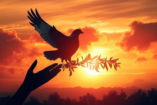 silhouette of a dove perched on an outstretched hand holding an olive branch against a glowing sunset with mountains and clouds, evoking peace and hope