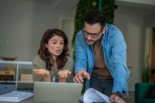 Couple experiencing financial confusion and solving problems at home
