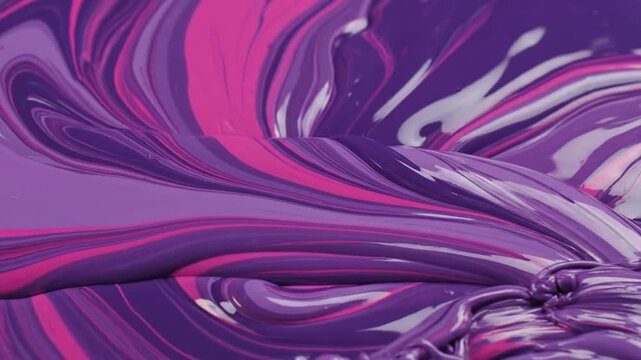 Purple, pink, and white paint swirl together, creating a textured, flowing design