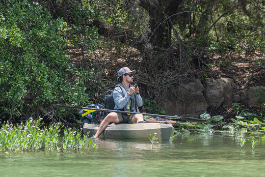 Fisherman hook-setting from a kayak