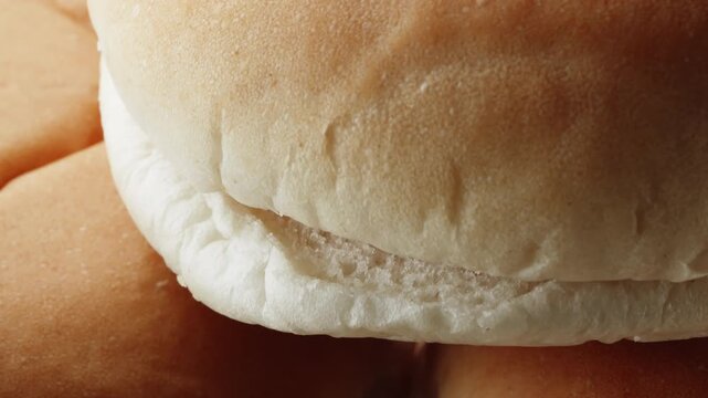 Teacake bread bun roll extreme macro close up with a rotating camera motion stock footage