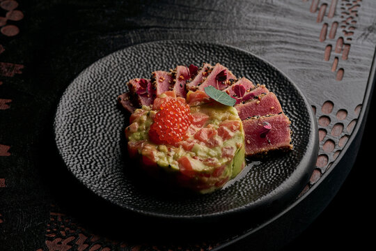 Gourmet Seared Tuna Tataki with Salmon Tartare and Red Caviar.