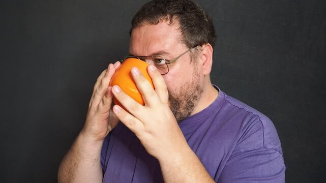 Funny fat man drinking hot coffee