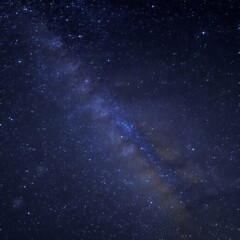 A dense field of twinkling stars against a dark sky with the Mil