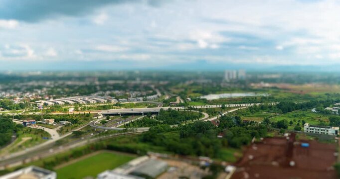 Timelapse of a busy highway intersection in Jakarta outskirt (BSD) in the afternoon, tilt shift effect