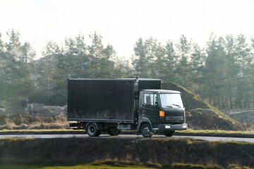 Commercial cargo van moving on outdoor route