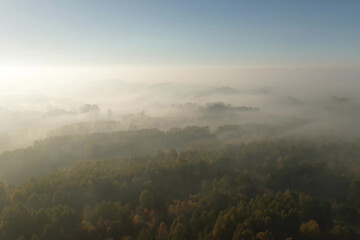 Obraz premium Clear sky over misty autumn landscape and rural village