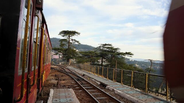 mountain railway engine approaching station with scenic valley view video is taken at shimla himachal pradesh india.