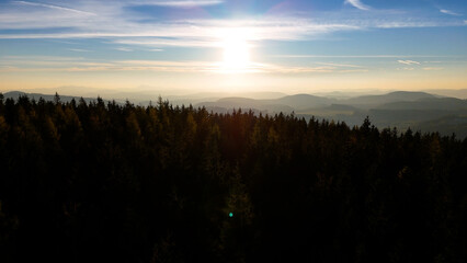 Drone flight over sunrise, mountains, forest, USA, America
