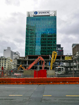 Heavy construction equipment works on a demolition and redevelopment site in the Britomart area of Auckland, New Zealand