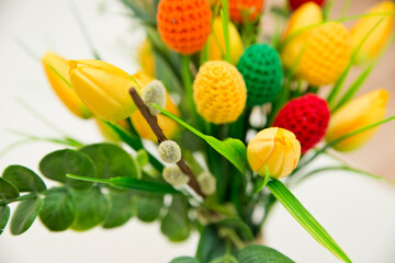 The breeze of spring. Easter composition with tulips and crocheted eggs. Featuring bouquets with handmade accents.
