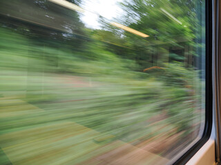 Picture of motion blur looking out of a modern train window © chris