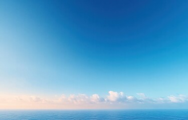 Obraz premium Calm ocean meeting clear blue sky at a serene horizon with soft warm light and low scattered clouds, minimalist tranquil seascape