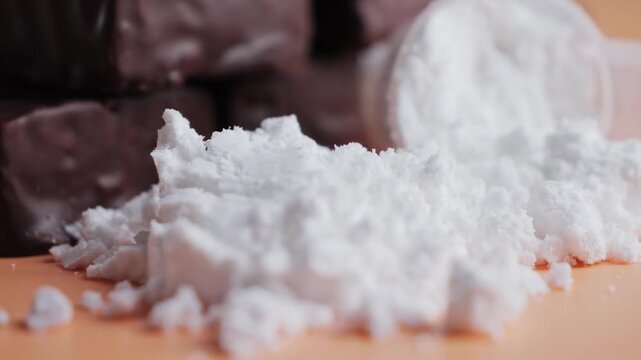 Vanilla protein powder in scoop and chocolate protein bars. Dietary supplement, nutrition, healthy energy snack. High quality 4k footage