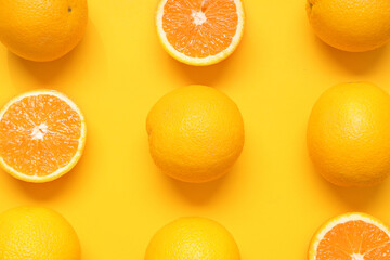 Fototapeta premium Composition with ripe tasty oranges on orange background, closeup