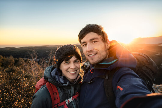 Selfie of happy couple at the Ligurian coast at sunset, Finale Ligure, Italy