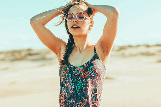 Portait of young woman in desert landscape