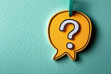 yellow speech bubble tag with white question mark hanging from teal ribbon on textured teal background conveying curiosity and uncertainty