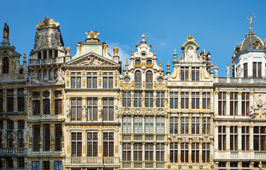 Fototapeta premium Opulent Baroque architecture detail on a building facade in Brussels. Many rectangular windows evoke concept of privacy and rich living. Rococo decoration on wealthy central apartments in Bruxelles