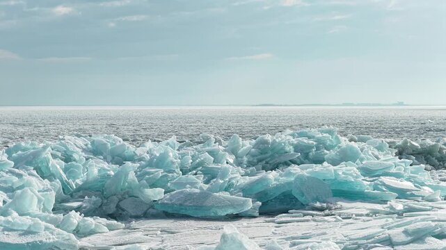 
Hummocks on the Kapchagai reservoir. Ice blocks covering the lake. Winter time. The view from the drone.