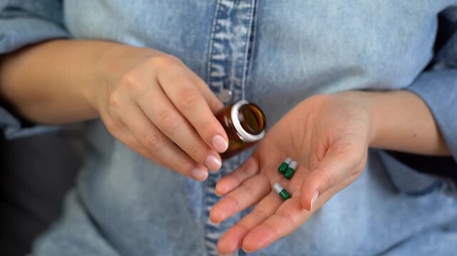 Hands open jar with pills. Pills and drugs medicament vitamins. Take medicine take pill. Medicine and health care