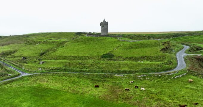 Aerial Orbit of Doonagore Castle in Fog near Doolin, Ireland