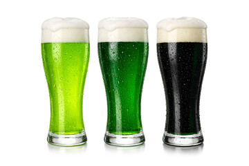 Three glasses of beer with different shades of green and dark stout liquid with foam and water droplets isolated on white background