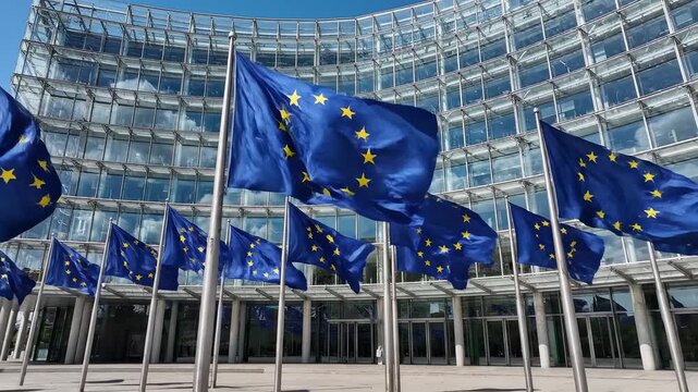 European flags waving in front of modern building