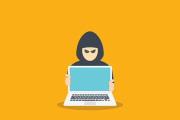 hacker in front of his computer committing digital cybercrime